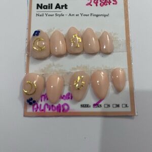 Almond Nude Press-On Nails with Gold Moon & Cross Details